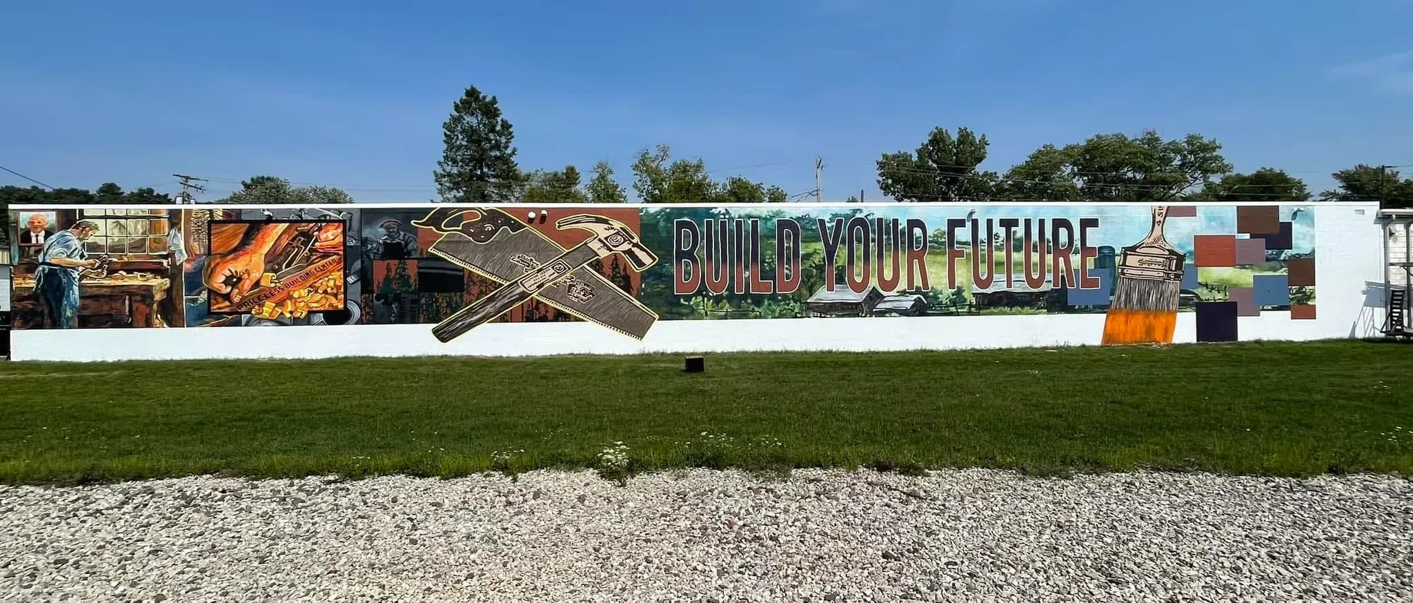The Build Your Future mural on the warehouse