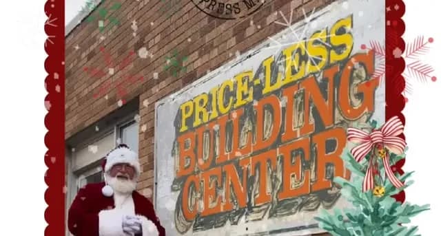 Santa visiting the Price-Less storefront during the annual Santa's Workshop