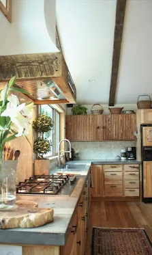 Rustic kitchen with exposed beam and reclaimed wood vent shroud.