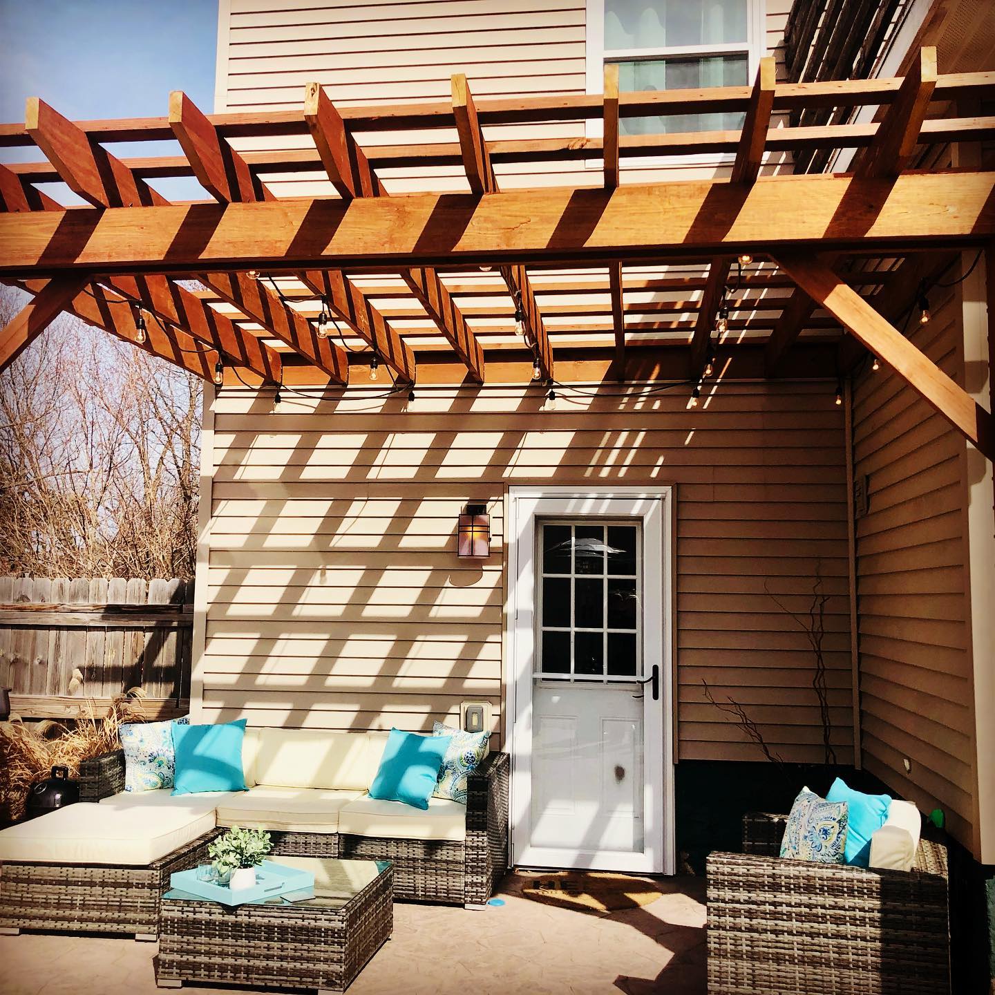 Outdoor pergola and patio in daylight.